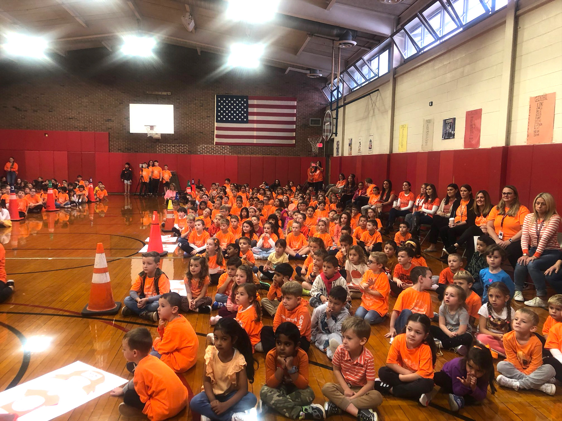 Students wearing orange at assembly