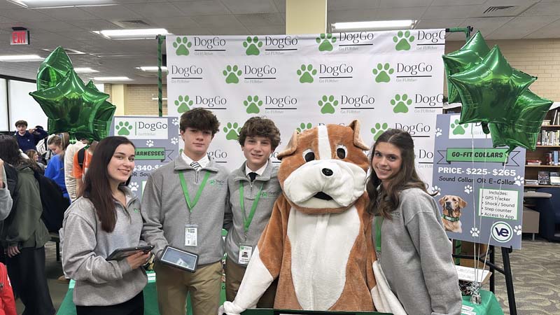 Students and mascot posing for picture