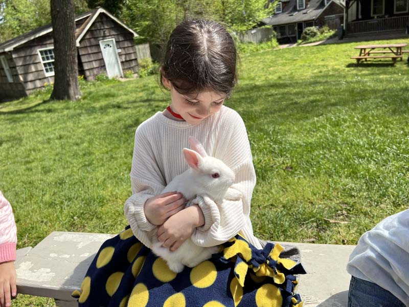 student holding a bunny