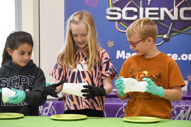 Students with science experiments
