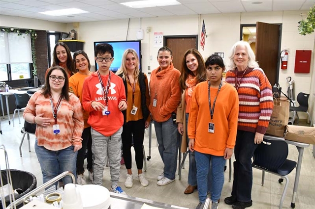 Students and staff wearing orange