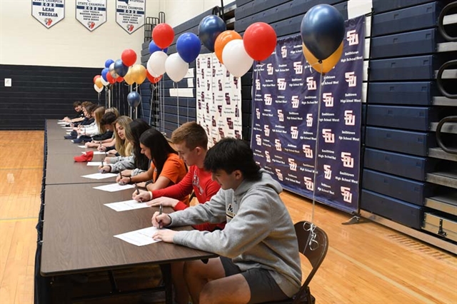 Students signing