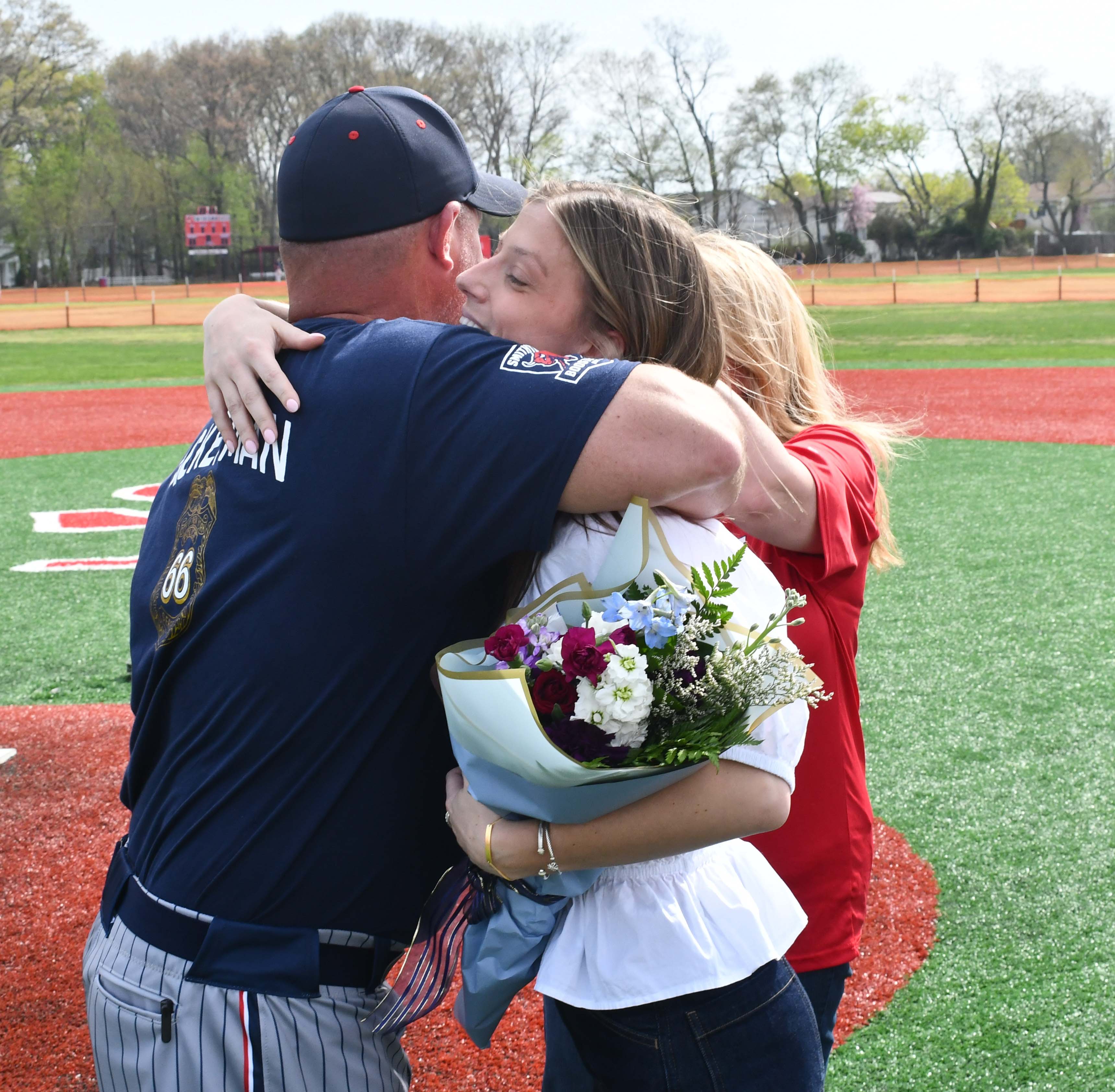 Delaney hugging a coach