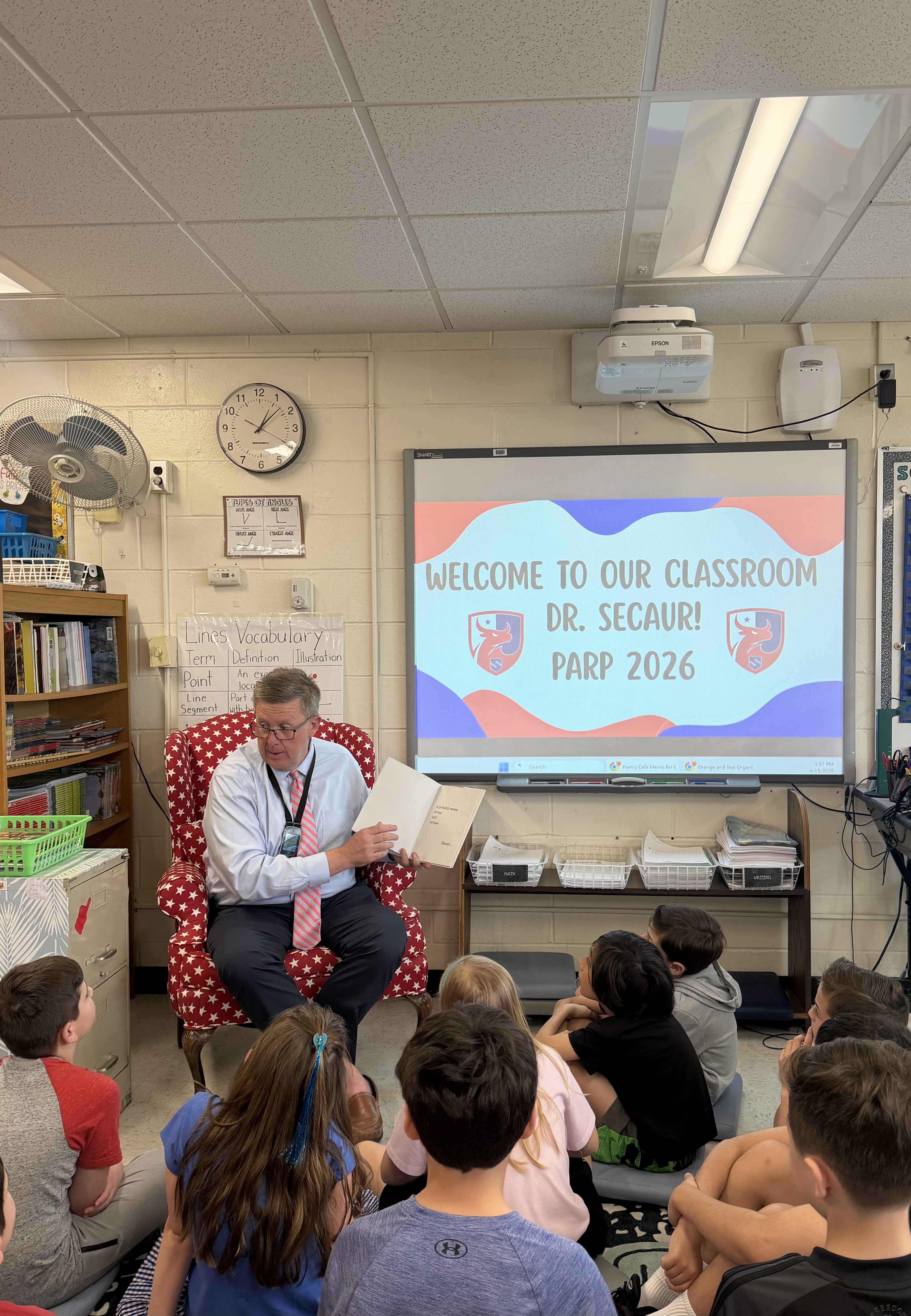 Dr. Secaur reading to students