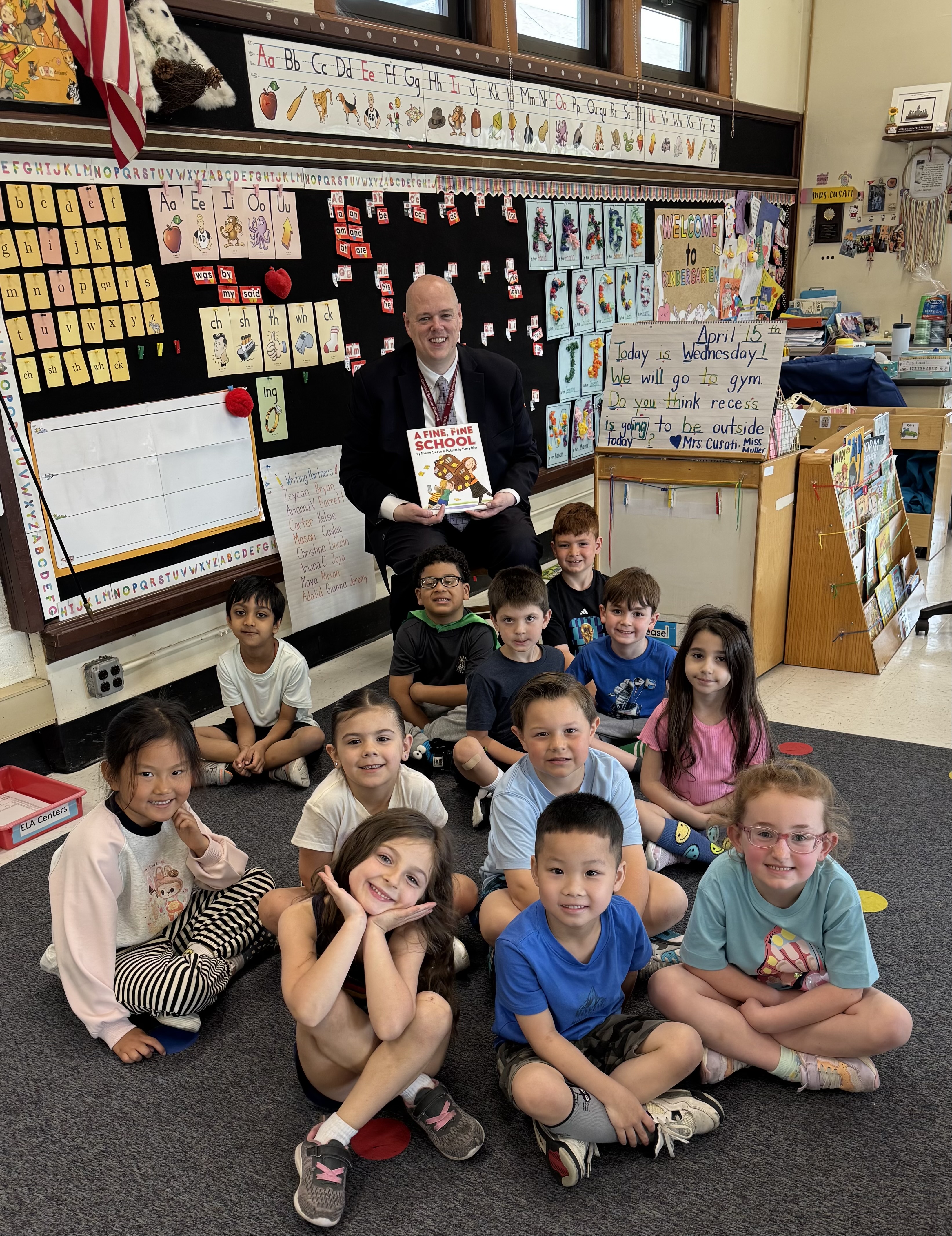 Paul Strader reading to students