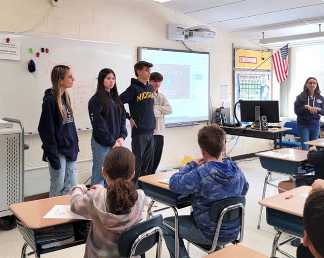 HSW world language students speaking with elementary students