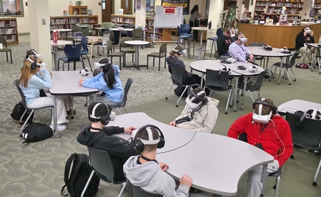 students wearing virtual reality headsets