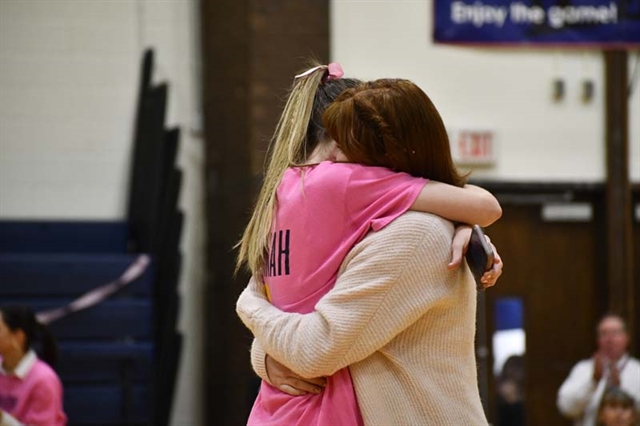 Hannah hugging her sister