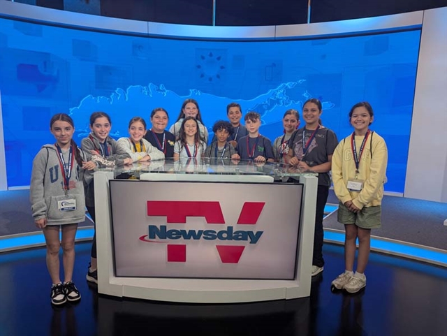 students posing for picture at Newsday