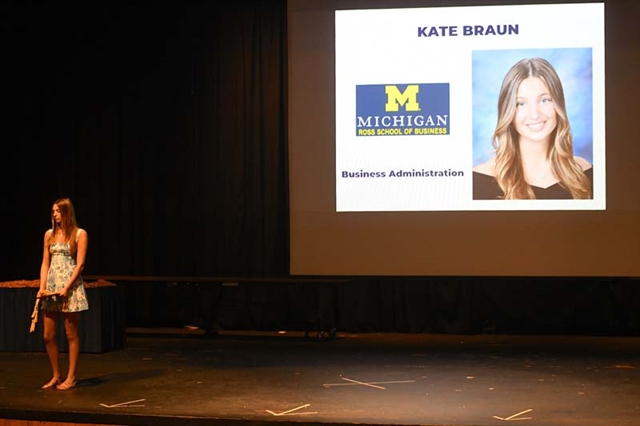 Student on stage receiving award