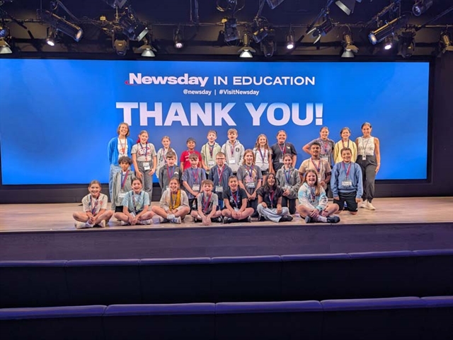 students posing for picture at Newsday