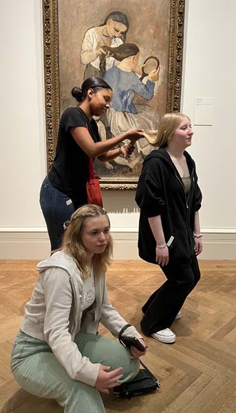 students by a painting