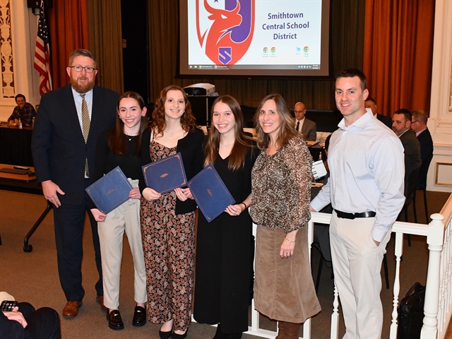 HSE students taking picture with BOE member and Superintendent