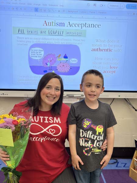 teacher and student posing for picture