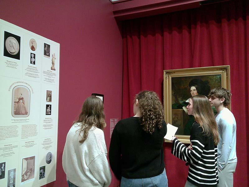 students at exhibit
