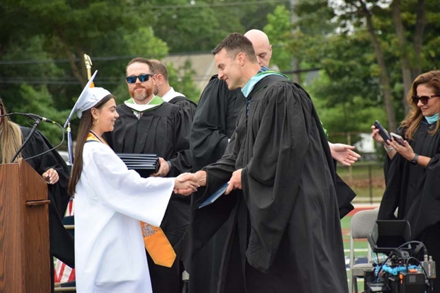 student getting diploma