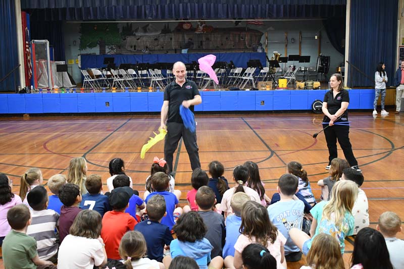 Circus trainer teaching students