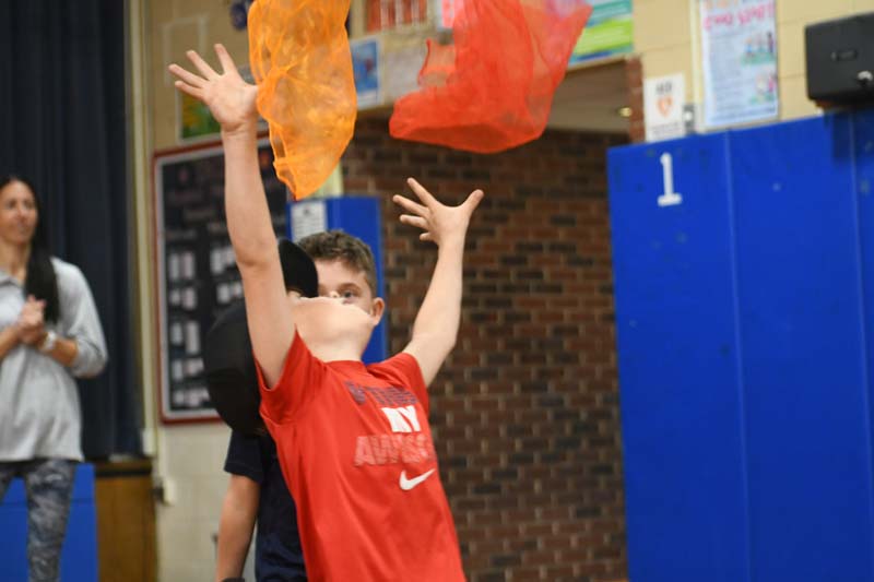 Student doing circus tricks
