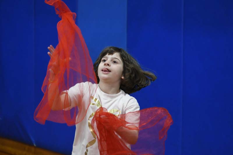 Student doing circus tricks