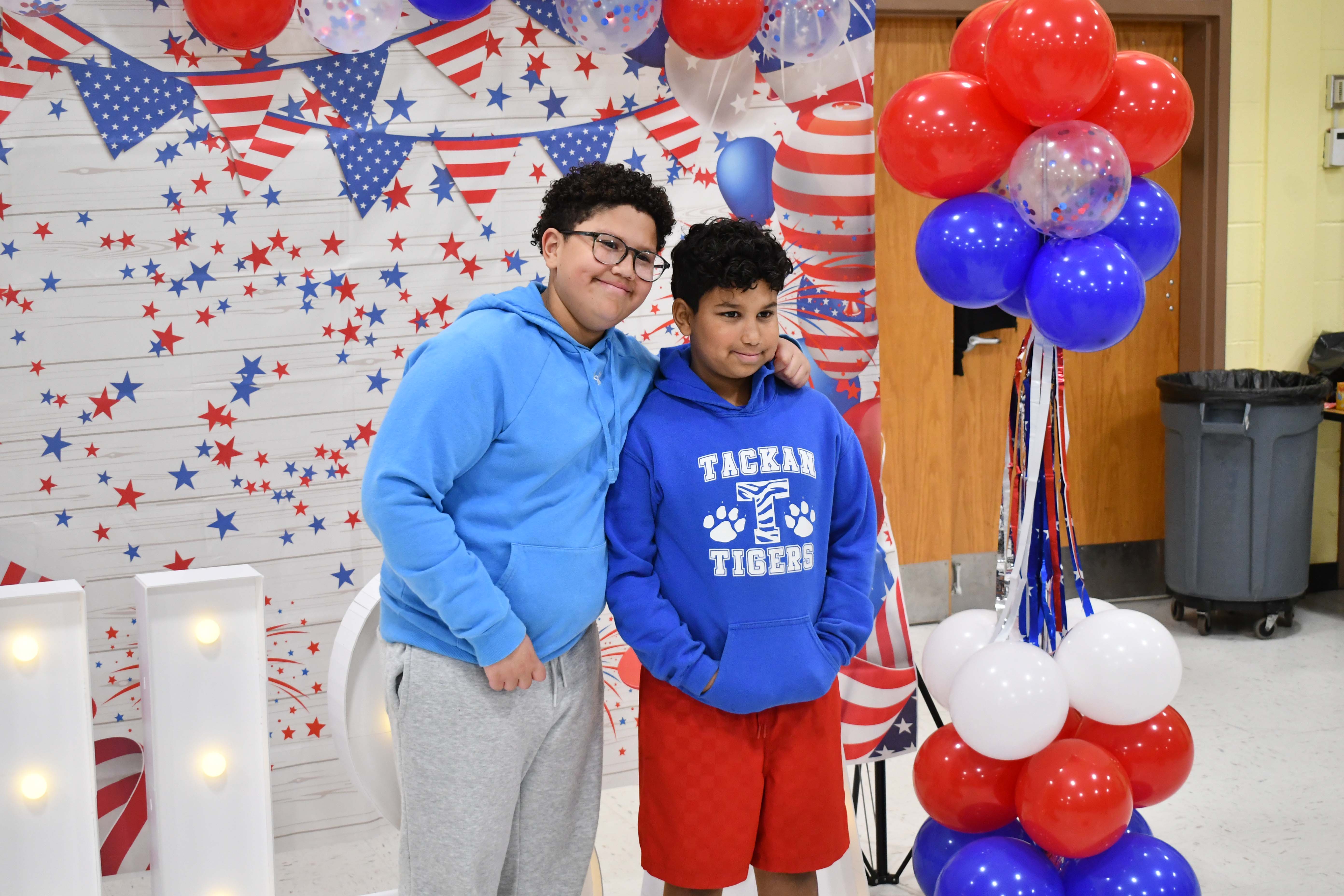 Students in front of sign