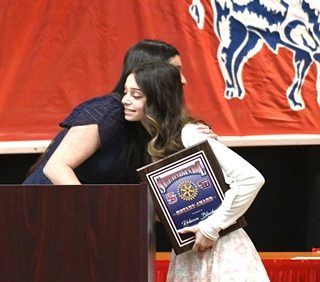 student hugging counselor