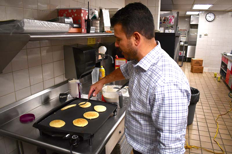 Principal Ierano making pancakes