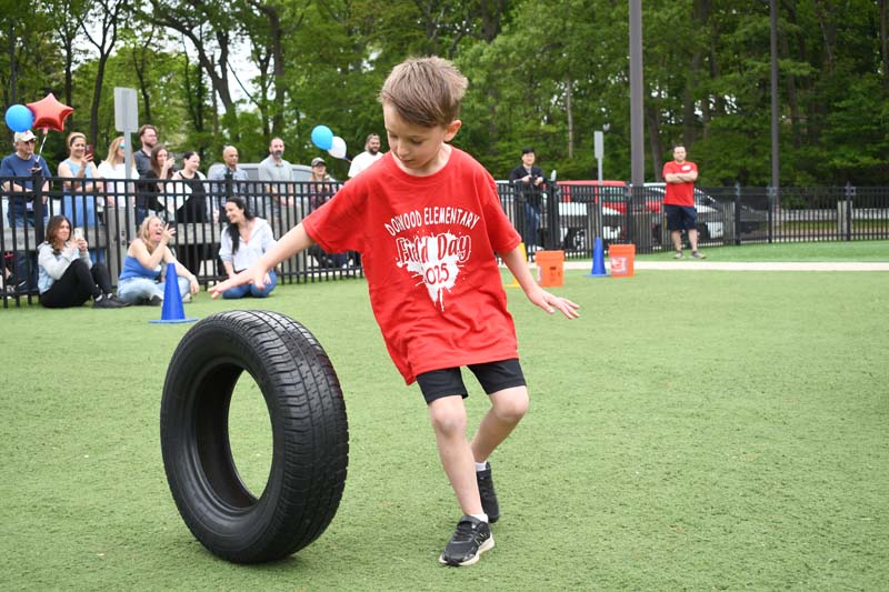 Student in wheelbarrow race