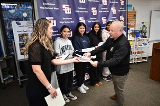 Person handing out certificates