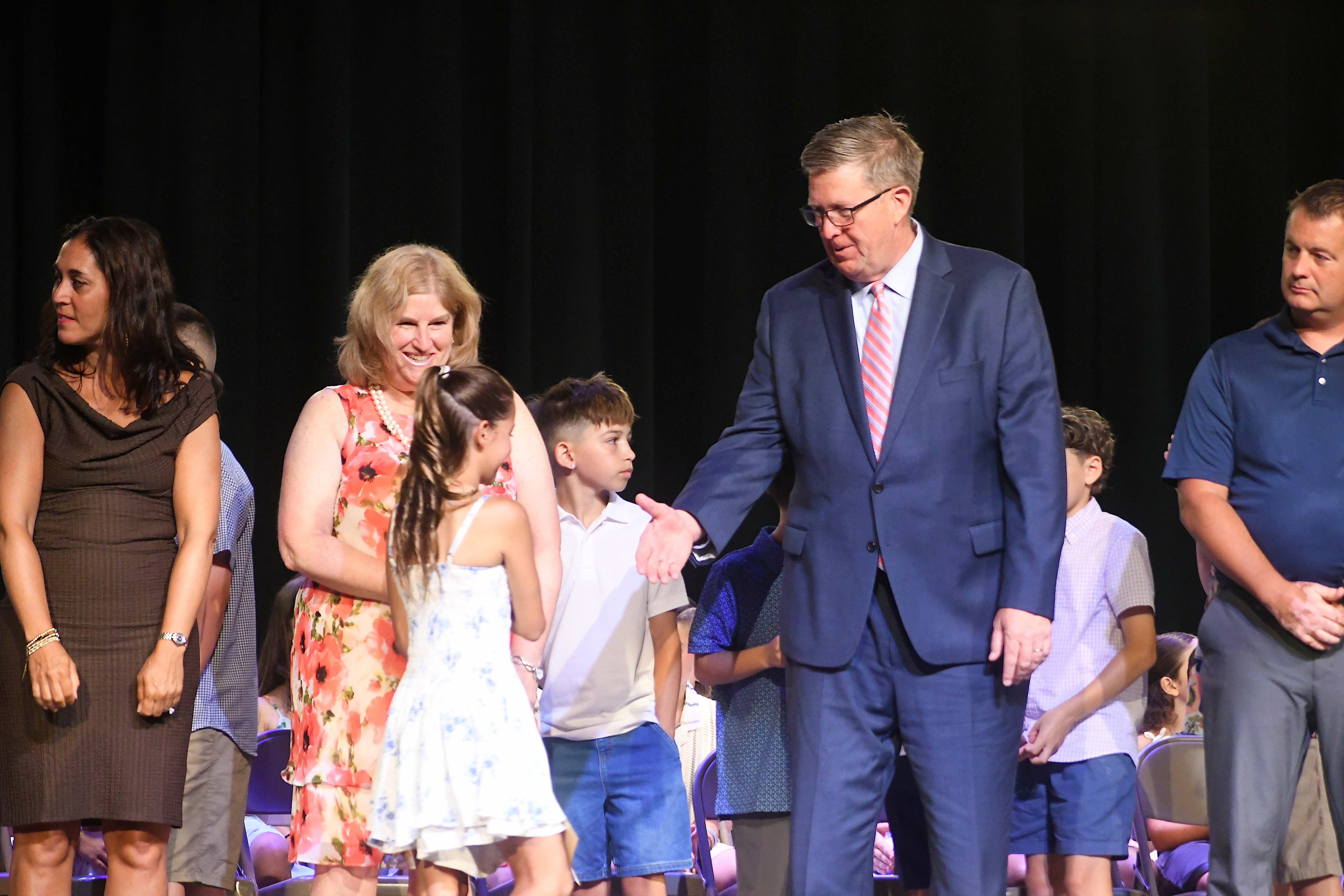 Dr. Secaur congratulating student