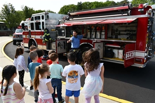 firefighter talking to students