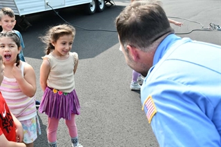 Student talking to firefighter