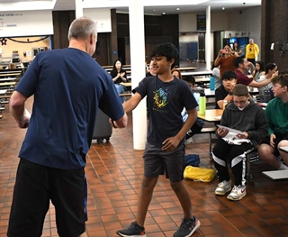 Student shaking hands