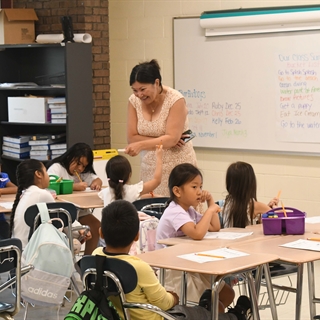 Teacher instructing students