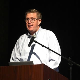 Dr. Secaur speaking