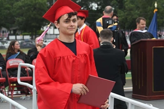 Student with diploma