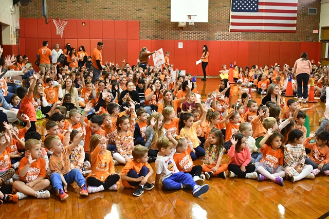 orange clad students