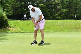 Person golfing