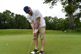 Person golfing