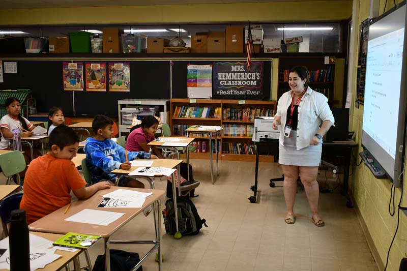 Teacher in class with students