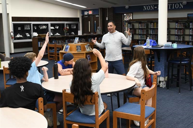 Teacher talking to students