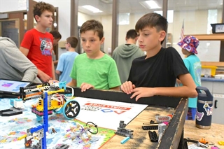 Students with robotics