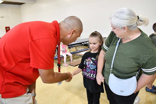 Principal shaking hands