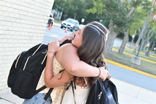 students hugging