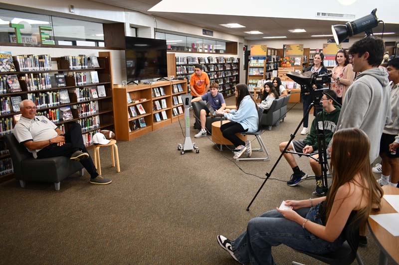 Students interviewing a subject