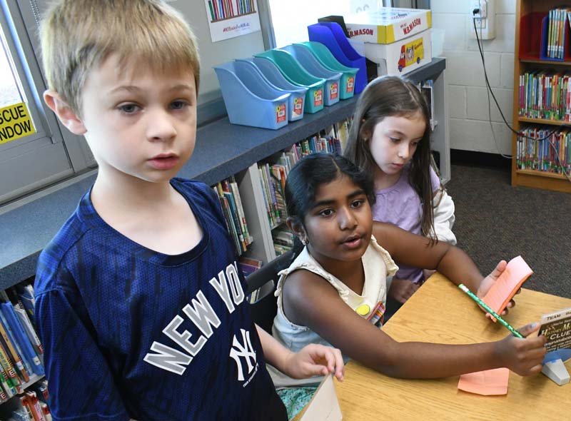 Students looking at clues