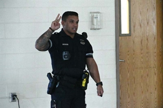 Officer Allison speaking