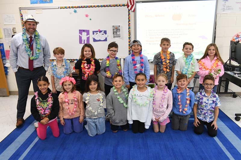 students and principal smiling for picture