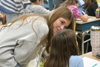 High School student teaching younger student