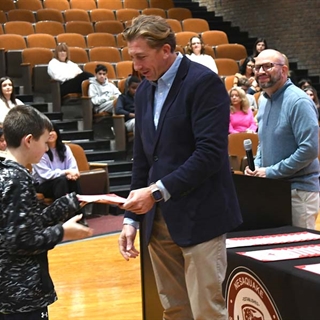 student getting certificate