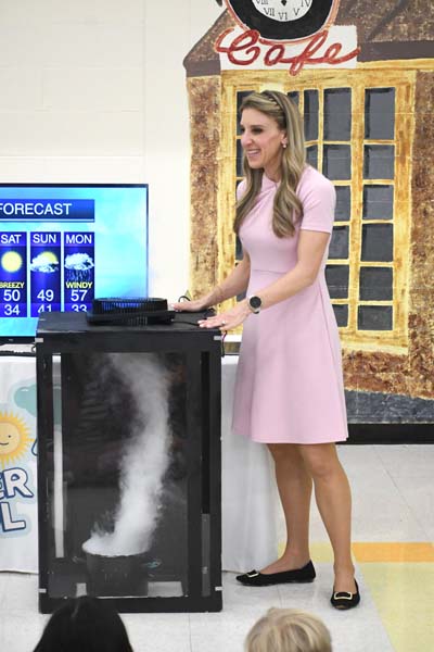 Sam Augeri teaching weather